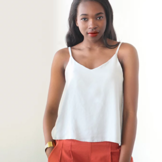 Woman wearing the Ogden Cami sewing pattern by True Bias. A camisole pattern made in crepe, rayon challis, voile or lightweight linen fabric featuring a soft V-neck at both centre front and centre back and delicate spaghetti straps.