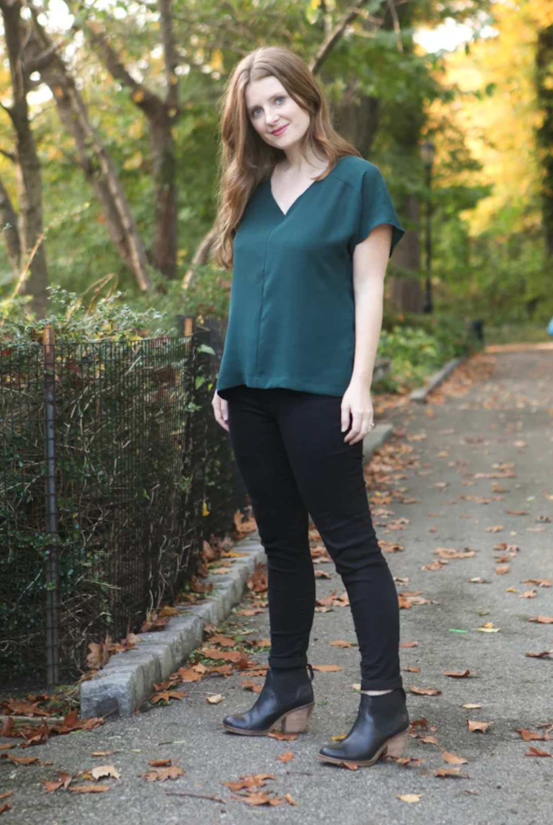 Woman wearing the Sutton Blouse sewing pattern by True Bias. A loose fitting V-neck top pattern made in rayon challis, crepe, silk or lightweight linen fabric featuring grown on sleeves, a one-piece yoke and a back inverted pleat.