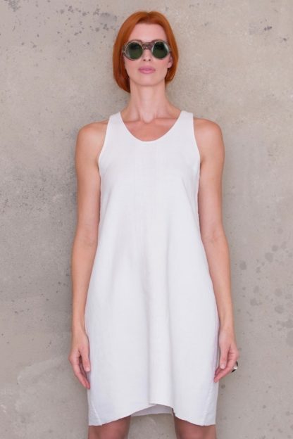 Woman wearing the Slip Dress sewing pattern by Ann Normandy. A slip dress pattern made in heavy rustic linen fabrics, featuring a flattering A-line silhouette and above the knee length.