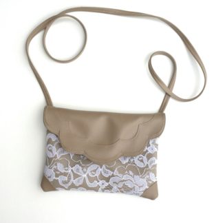The Scalloped Bag sewing pattern by Goheen Designs. A clutch bag made in vinyl, leather, denim or upholstery fabrics, featuring a narrow cross body strap and scalloped edging.