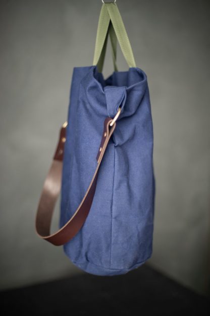 The Jack Tar Bag sewing pattern by Merchant and Mills. A bucket bag pattern made in oilskin, canvas, cotton drill or denim fabric featuring three divided internal pockets, fully lined and plenty of room.