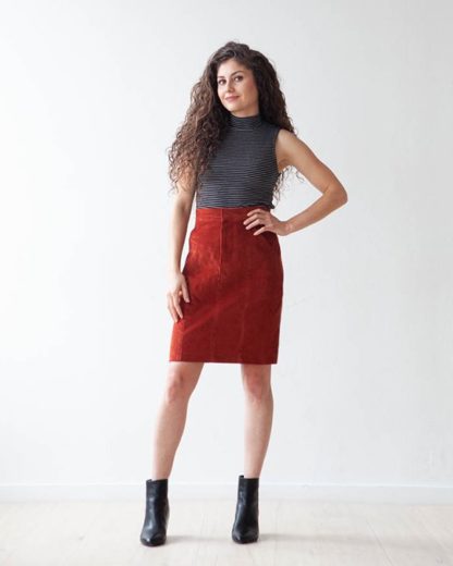 Woman wearing the Salida Skirt sewing pattern by True Bias. A fitted, panelled skirt pattern made in denim, twill, corduroy or linen fabric featuring a high waist, front fly zipper and pockets.