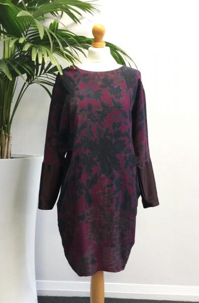Photo showing the Geo Dress sewing pattern from Sew Different on The Fold Line. A dress pattern made in crepe, viscose or jersey fabrics, featuring a relaxed fit, batwing shape, round neck, raglan sleeves, in-seam deep pockets and above knee finish.