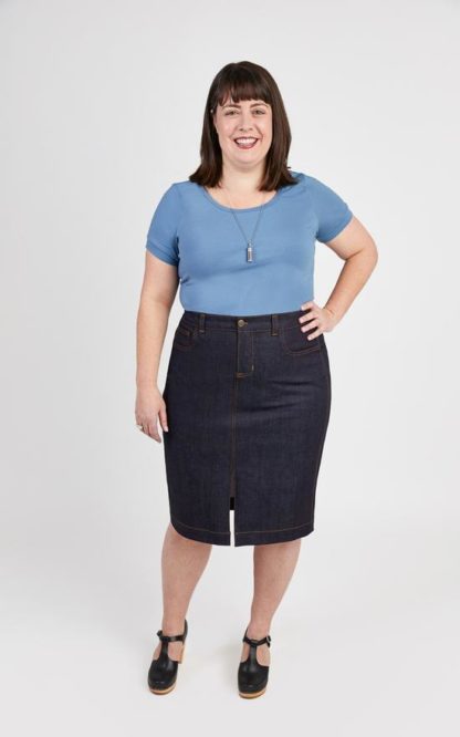 Woman wearing the Ellis Skirt sewing pattern by Cashmerette. A skirt pattern made in denim, corduroy or canvas fabric featuring a knee length hem, front slit, 5 pockets, front fly closure and top stitching.