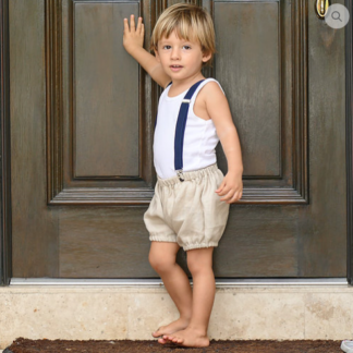 Child wearing the Child/Baby Bloomers sewing pattern from Elemeno Patterns on The Fold Line. A shorts pattern made in woven or cotton knit fabrics, featuring a relaxed fit, and elasticated leg opening and waist.