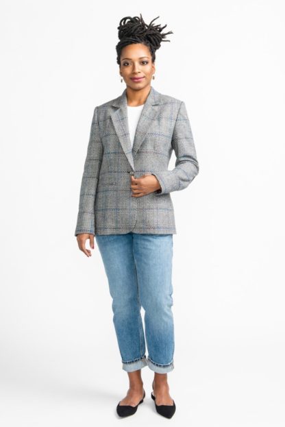 Woman wearing the Jasika Jacket sewing pattern by Closet Core Patterns. A classic tailored jacket pattern made in wool melton, wool flannel, crepe or tweed featuring a semi fitted shape, fully lined, back vent, shoulder pads and welt pockets.