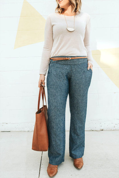 Woman wearing the Port City Pants sewing pattern from Sew To Grow on The Fold Line. A trouser pattern made in linen, chambray, tencel, or rayon, fabrics, featuring a straight leg, front slash pockets, front waistband yoke, and elasticised back waist.