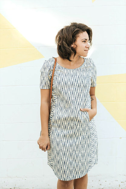 Woman wearing the Fremantle Frock sewing pattern from Sew To Grow on The Fold Line. A dress pattern made in cotton, chambray, linen or quilting cotton fabrics, featuring contouring princess lines, hidden pockets, curved