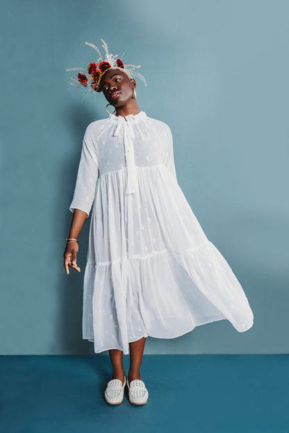 Women wearing the Wilder Gown sewing pattern by Friday Pattern Company. A loose, flowy, tiered dress pattern made in rayon, silk or linen fabric featuring raglan sleeves and ties at the neck.