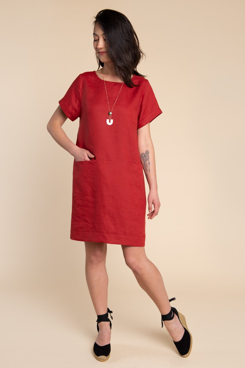 Woman wearing the Cielo Dress sewing pattern by Closet Core Patterns. A shift dress pattern made in linen, chambray, or cotton shirtings fabric featuring sleek inseam pockets and slightly dropped shoulders.