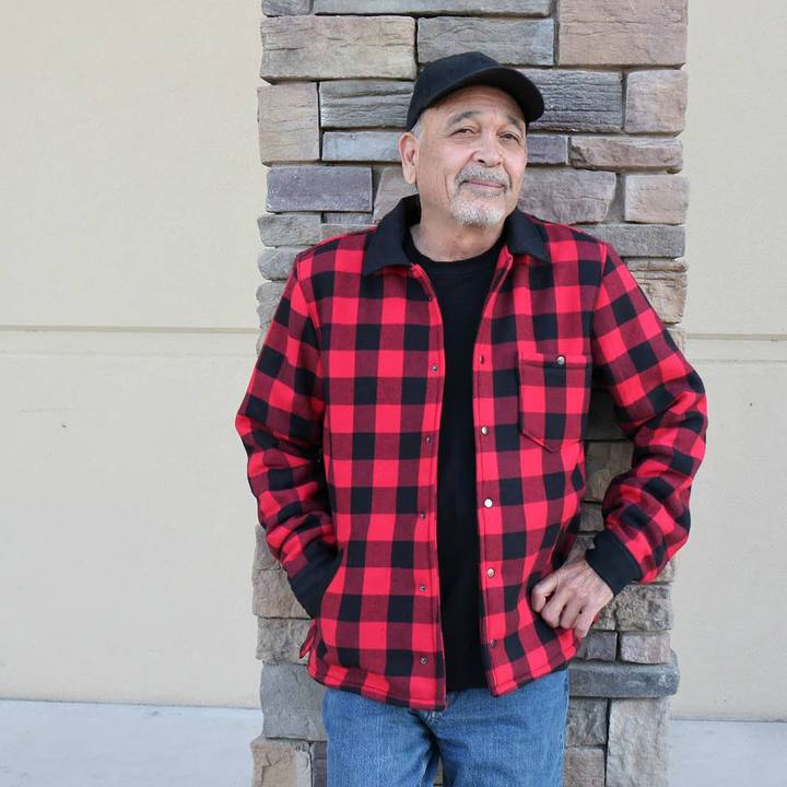 Man wearing Overshirt Jacket sewing pattern from Wardrobe by Me on The Fold Line. A shirt pattern made in cotton, linen or wool fabrics, featuring a convertible collar, several interchangeable pockets, two-piece cuffed sleeves, body has side slits, back yoke, and topstitching.