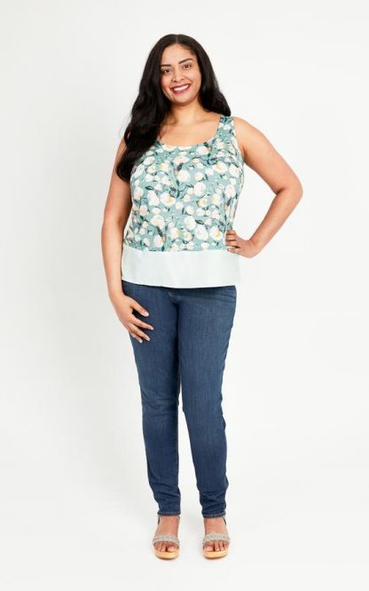 Woman wearing the Springfield Top sewing pattern by Cashmerette. A sleeveless top pattern made in cotton lawn, linen, chambray, or crepe fabric featuring a scooped neckline, back yoke, and split side seams.