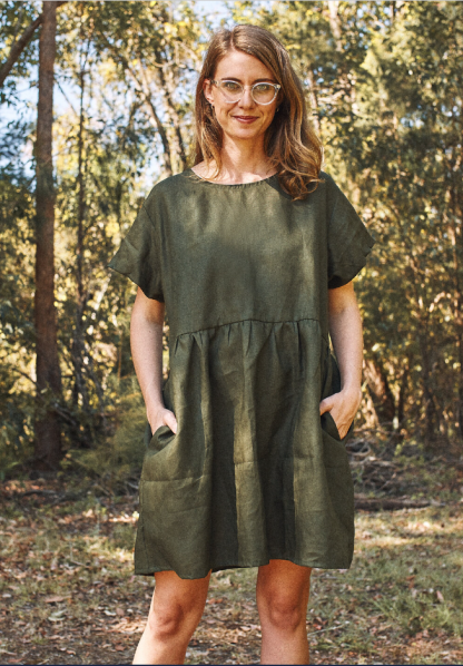 Woman wearing the Fawn Dress sewing pattern by Common Stitch. A dress pattern made in cotton or linen fabrics, featuring short sleeves, above knee length, two front pockets and relaxed fit.