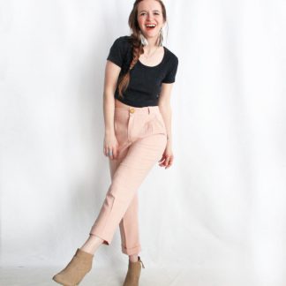 Woman wearing the Nita Trousers sewing pattern by Amy Nicole. A trouser pattern made in light to medium weight fabrics such as tencel twill, silk noil, linen and medium weight cotton fabrics, featuring a high-waist, slash front pockets, cropped length and tapered leg.