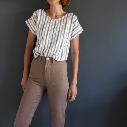 Woman wearing the Bowery Top sewing pattern by French Navy. A top pattern made in linen, chambray, cotton shirting or viscose/rayon blended fabrics, featuring a back button closure, cuffed dolman sleeves, curved hemline and patch pocket.