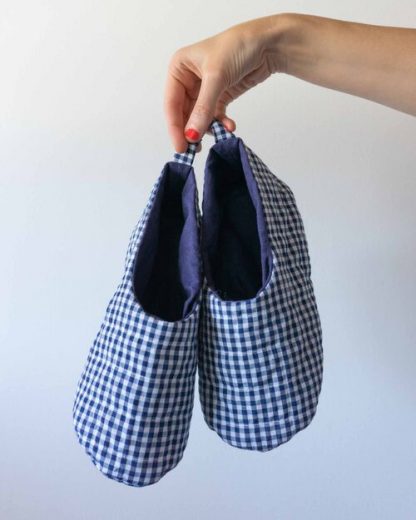 Photo showing the Unisex Quilted Slippers sewing pattern from Sew DIY on The Fold Line. A slippers pattern made in medium-weight cotton, linen, flannel, or pre-quilted fabrics, featuring an open top skimmer style and heel tab.