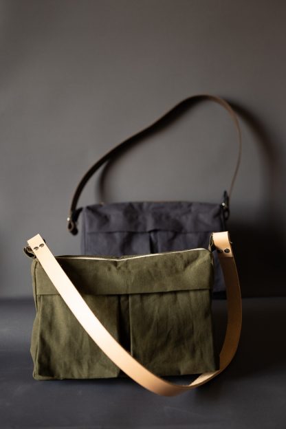 The Factotum Bag sewing pattern by Merchant and Mills. A cross body bag pattern made in oilskin, cotton canvas, denim or drill fabric featuring two front pockets, zip closure and fully lined.
