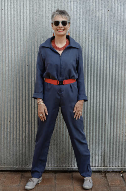 Woman wearing the Intrepid Boiler Suit sewing pattern by Alice and Co Patterns. A boiler suit pattern made in light-weight denim or cotton twill, light wool or wool mix, heavy-weight silk or polyester crepe fabrics, featuring a classic shirt collar and slightly tapered leg, a zip down the centre-front. The suit is loose-fitting but not baggy.
