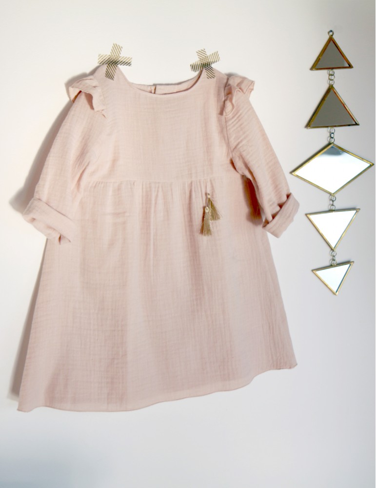 Image showing the Bouton d'Or Dress sewing pattern by Atelier Scammit. A dress pattern made in batiste, double gauze or jersey fabrics, featuring shoulder yokes and sleeve caps, in long sleeves, back button closure and gathered skirt.