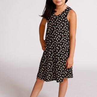Child wearing the Baby/Child Mini Pony Dress sewing pattern by Chalk and Notch. A tank dress pattern made in light to medium weight 75% – 100% stretch knit fabrics, featuring an A-line silhouette, V-neckline and curved hem.