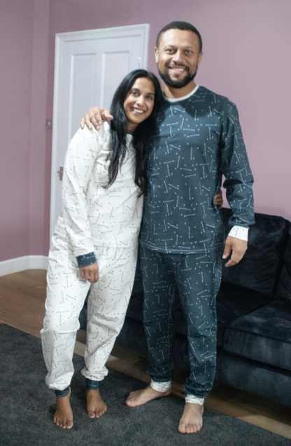 Man and Woman wearing the Men’s Pops Perri PJs sewing pattern from Pattern Paper Scissors on The Fold Line. A pyjamas pattern made in jersey or viscose jersey fabrics, featuring a round neck top with full length sleeve and cuff, trousers have full length leg with cuff and elasticated waist.