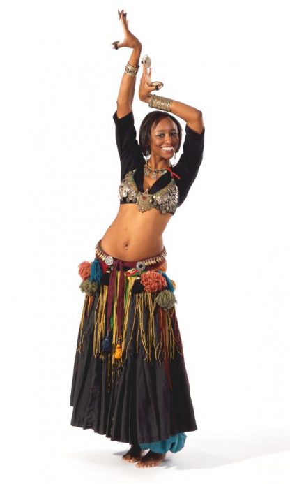 Woman wearing the 144 Belly Dancer Outfit sewing pattern from Folkwear on The Fold Line. A belly dancers pattern, featuring a fitted backless bra, tassel belt, hip shawl, ten yard skirt and pantaloons.