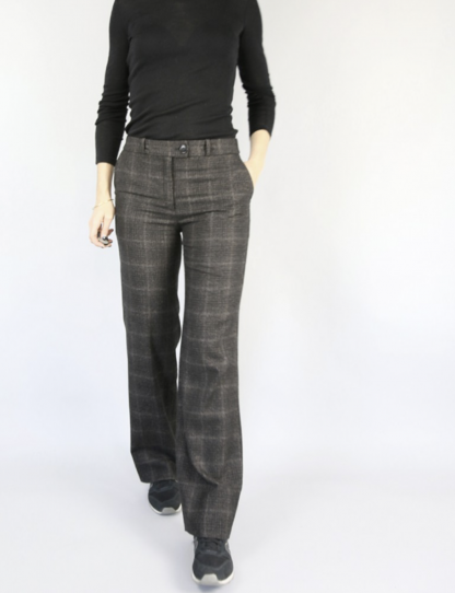 Woman wearing the Allure Trousers sewing pattern by Atelier Scammit. A trouser pattern made in denim, tweed, velvet or flannel fabrics, featuring a straight leg, mid-rise and Italian pockets.