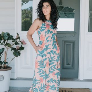 Woman wearing the Sycamore Lane Dress sewing pattern from Sew To Grow on The Fold Line. A dress pattern made in rayon, lawn, Tencel, cupro, chambray, gauze, or voile fabrics, featuring a maxi length, side splits, sleeveless, fitted at waist with darts, side invisible zipper, in-seam pockets, and narrow shoulder straps.