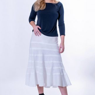 Women wearing the Sierra Tiered Bias Skirt sewing pattern from The Pattern Cutters on The Fold Line. A skirt pattern made in lightweight fabrics such as soft linen, featuring a midi-length, bias cut with multiple tiers, flared silhouette and elastic waist with no waistband.