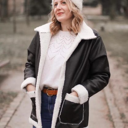 Woman wearing the Sweet Winter Biker Jacket sewing pattern from You Made My Day Patterns on The Fold Line. A jacket pattern made in double-sided faux leather/faux fur fabrics, featuring patch pockets, unlined, no closures, back darts, collar, and lapels.