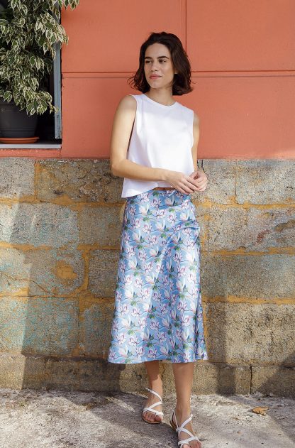 Woman wearing Helen Skirt sewing pattern from The Patterns Room on The Fold Line. A skirt pattern made in soft denim, soft gabardine or wool fabrics, featuring an A-line bias cut, midi length, and invisible side seam zipper.