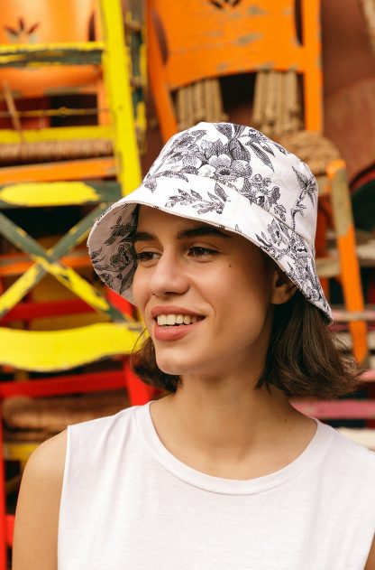 Woman wearing Hope Bucket Hat sewing pattern from The Patterns Room on The Fold Line. A bucket hat pattern made in canvas, wool or upholstery fabrics, featuring lining and medium width brim.