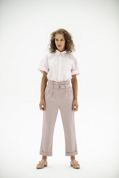 Woman wearing the Jasmin Trousers sewing pattern from Fibre Mood on The Fold Line. A trouser pattern made in (Stretch) cotton, stretch denim, linen, soft leather or gabardine fabrics, featuring a paperbag waist, relaxed fit, belt loops, belt, pockets and turn up ankle length hem.