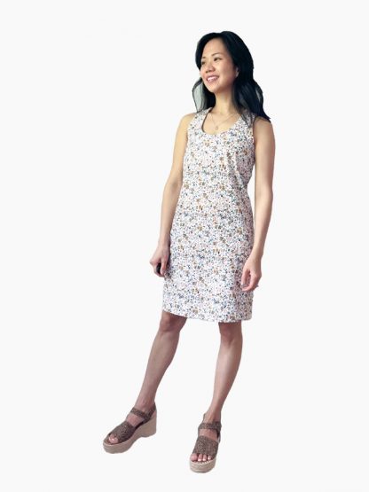 Woman wearing the Prescott Dress sewing pattern by hey June Handmade. A casual, sleeveless, knit dress pattern made in stable light to mid-weight knit fabrics, featuring a racer back, above knee length and scoop neckline.