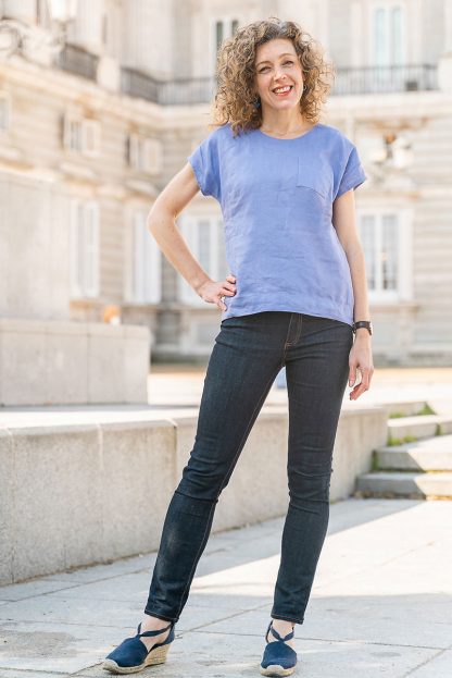 Woman wearing the Verdun Woven T-shirt sewing pattern by Liesl and Co. A T-shirt pattern made in lightweight woven fabrics such as linen, cotton lawn, voile, quilting cotton and rayon fabrics, featuring a relaxed fit, dropped shoulders, scooped neck and short sleeves.