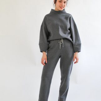 Woman wearing the Apollo Jumper sewing pattern from Bella Loves Patterns on The Fold Line. A jumper pattern made in heavy and medium weight knit fabrics, featuring an oversized fit, drop shoulders, high funnel neck, bracelet length sleeves with tapered cuffs.