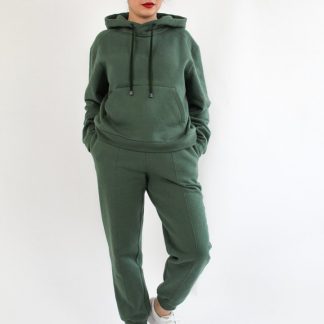 Woman wearing the Luna Joggers sewing pattern from Bella Loves Patterns on The Fold Line. A joggers pattern made in sweatshirting, French terry, Ponte Roma and double knits with cross-wise stretch, featuring a high waist, straight leg, in-seam side pockets and elastic waistband with drawstring.