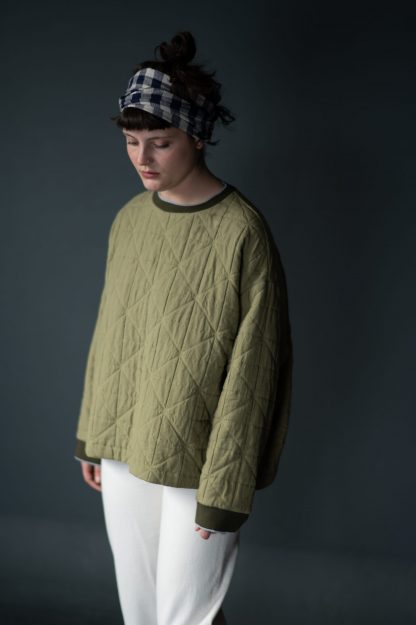 Woman wearing the Sidney Sweatshirt pattern from Merchant and Mills on The Fold Line. A sweatshirt pattern made in sweatshirting, jersey loopback or cotton jacquard fabrics, featuring a boxy silhouette, loose crew neck and finger skimming sleeves.