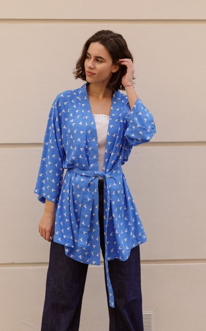 Woman wearing the Tania Robe sewing pattern from The Patterns Room on The Fold Line. A robe pattern made in viscose, rayon, linen or silk fabrics, featuring an oversized loose fit, dropped shoulders, square sleeves, thigh length and self-fabric belt.