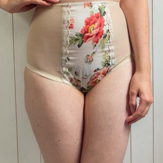 Woman wearing the Willow Knicker sewing pattern from Sew Projects on The Fold Line. A briefs pattern made in jersey, stretch satin, stretch mesh, stretch lace for the side and back. Cotton, lace, embroidery, silk, satin fabrics for the centre panel, featuring full back coverage, low rise leg, high waist and non-stretch central panel.