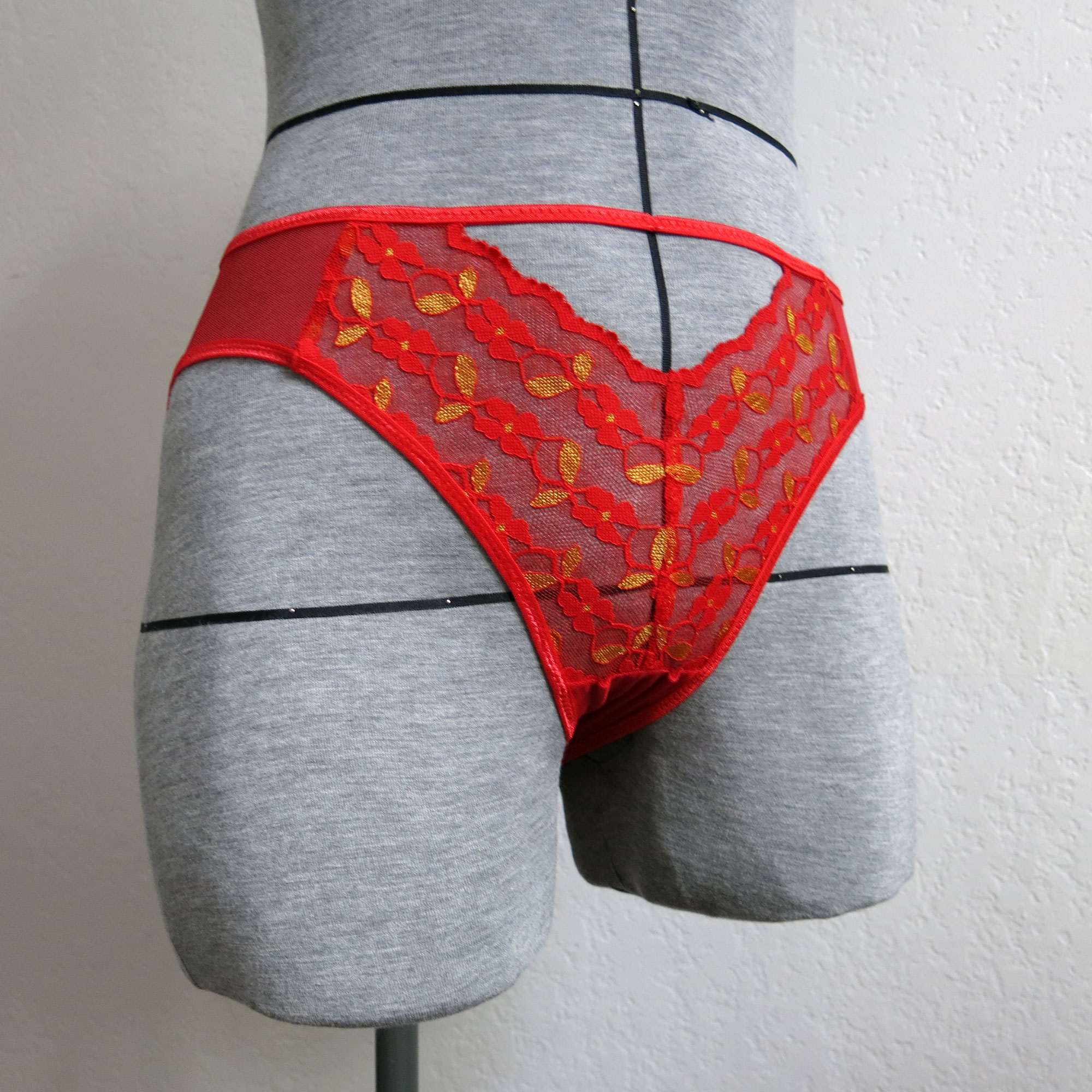 Image showing the Tulip Hi-Cut Panty pattern from Primrose Dawn on The Fold Line. A briefs pattern made in stretch lace trim, stretch knits, stretch mesh, stretch lace or athletic knit fabric, featuring a medium rise, medium coverage, fully enclosed gusset and a V-shaped stretch lace panel with centre seam.