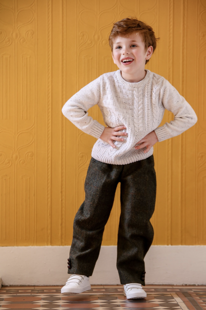 Child wearing the Baby/Child Turnberry Trousers sewing pattern from Greyfriars and Grace on The Fold Line. A trouser pattern made in a large men’s shirt or jacket fabrics, featuring an elastic waistband and relaxed fit.