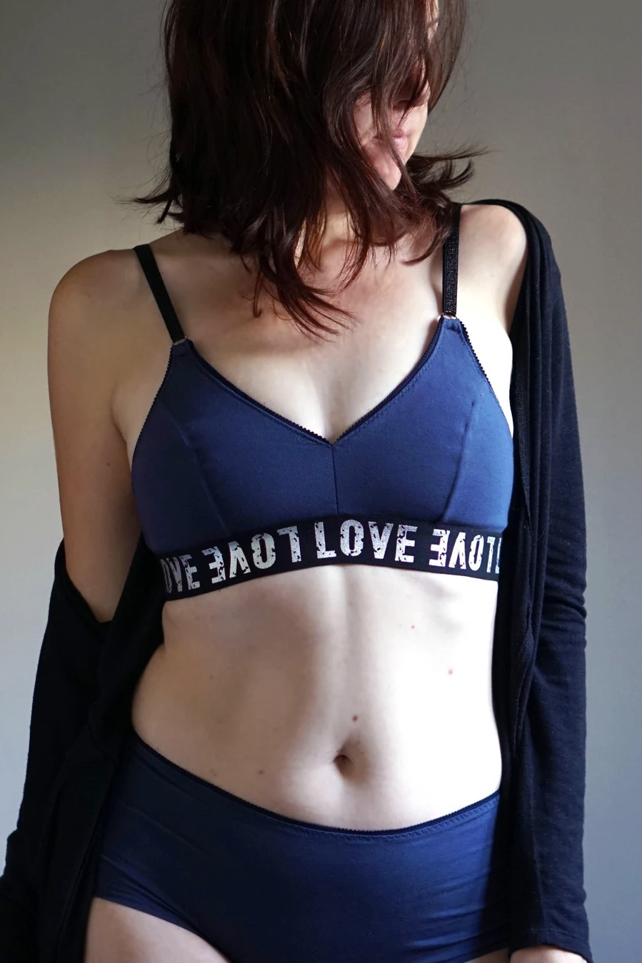 Woman wearing the WBM Bralette sewing pattern from Wardrobe by Me on The Fold Line. A bra pattern made in stretch lace, stretch mesh or jersey fabrics, featuring adjustable straps, two-part cup and wide elastic band underbust.