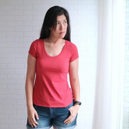 Woman wearing Builder T-shirt sewing pattern from Wardrobe by Me on The Fold Line. A top pattern made in light to medium weight jersey fabrics, featuring a scoop neck, short sleeves, and straight hemline.