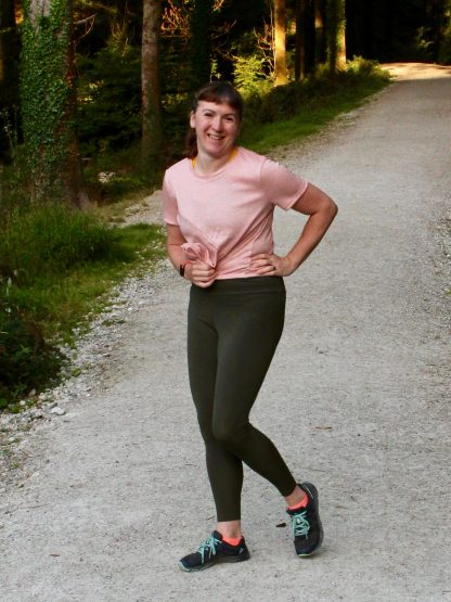 Woman wearing the Tenacity Leggings sewing pattern from Fehr Trade on The Fold Line. A leggings pattern made in lycra fabrics, featuring no side seams, wide high-rise waistband with hidden elastic and full length leg.