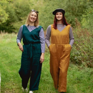 Women wearing the Cleo Jumpsuit sewing pattern from Sew Me Something on The Fold Line. A sleeveless jumpsuit pattern made in velvet, linen, light weight denim, cotton or viscose rayon fabrics, featuring a V-neck, wrap over back bodice, relaxed fit, pockets and sash belt.
