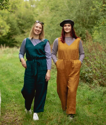 Women wearing the Cleo Jumpsuit sewing pattern from Sew Me Something on The Fold Line. A sleeveless jumpsuit pattern made in velvet, linen, light weight denim, cotton or viscose rayon fabrics, featuring a V-neck, wrap over back bodice, relaxed fit, pockets and sash belt.