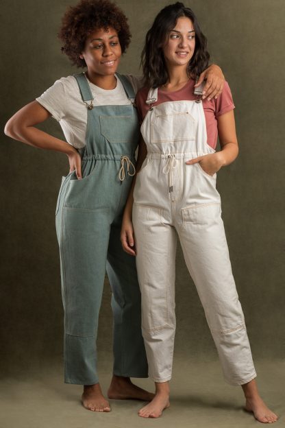 Women wearing the Partner Overalls sewing pattern from Ready to Sew on The Fold Line. A dungarees pattern made in denim, twill, canvas, gabardine, moleskin or linen fabrics, featuring additional extras such as curved inset pockets, faux fly, slimmer leg with a slight crop, double knee and topstitching details.