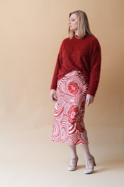 Woman wearing Sasha Skirt sewing pattern from Lenaline Patterns on The Fold Line. A skirt pattern made in satin cotton, viscose, silk or lightweight fabrics, featuring a flared silhouette, elastic waistband, bias cut and midi length hem.