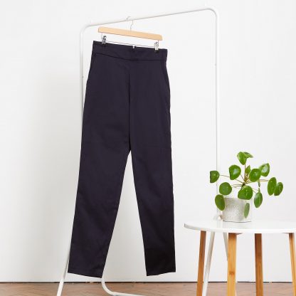 Photo showing the Geran Trousers pattern from PH7 Patterns on The Fold Line. A trouser pattern made in cotton, cotton mix, linen or linen mix fabrics, featuring a high waist, angled front pockets, concealed back zip and fitted silhouette.